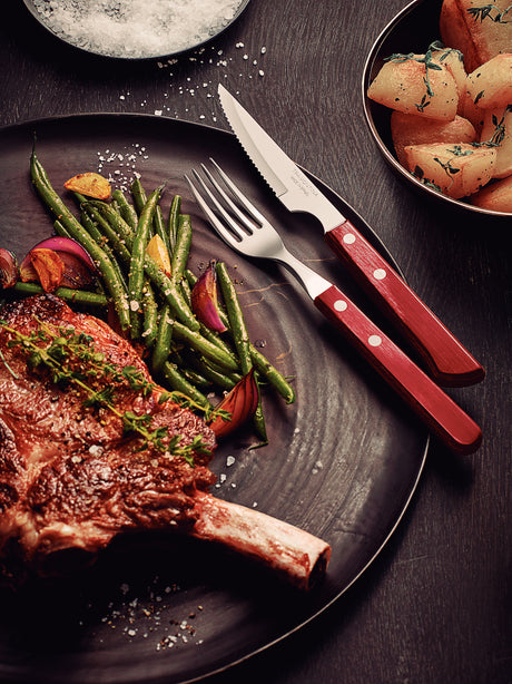 12-Piece Stainless-Steel Flatware Set with Red Polywood Handles.